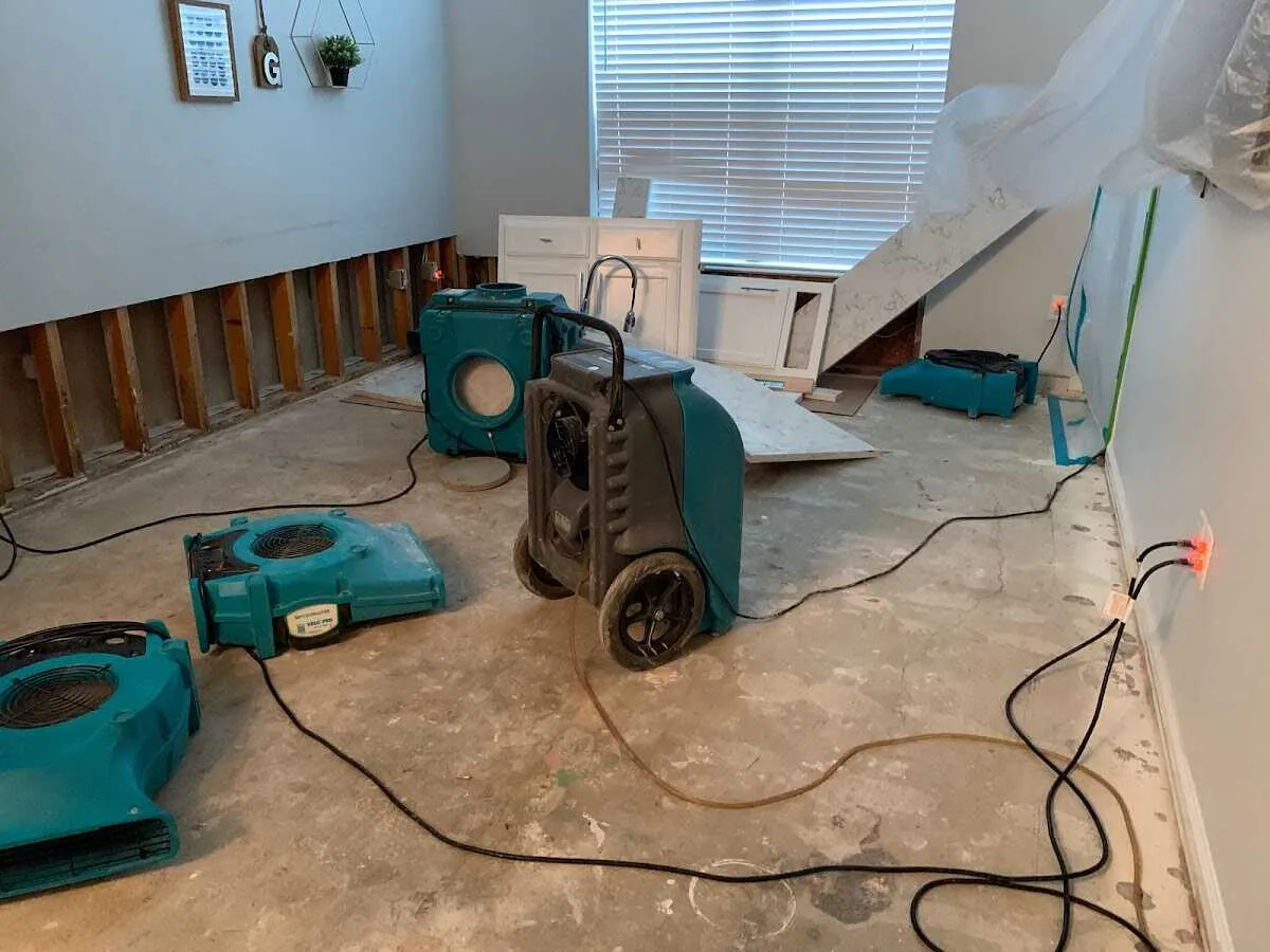 Dehumidifier in flood-cut room for Water Damage Restoration in Manchester